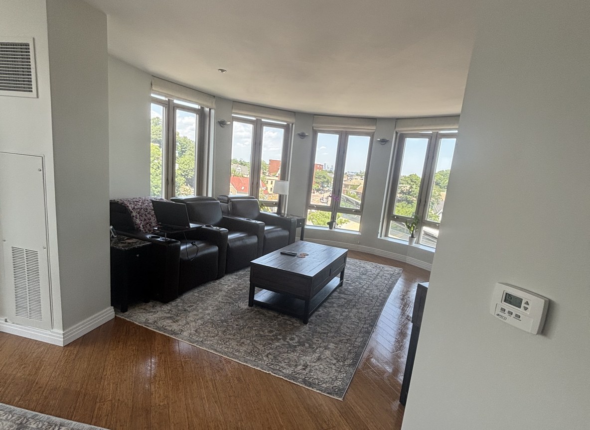 Bright condo living room with city views, professionally cleaned by Allegry Cleaning Services