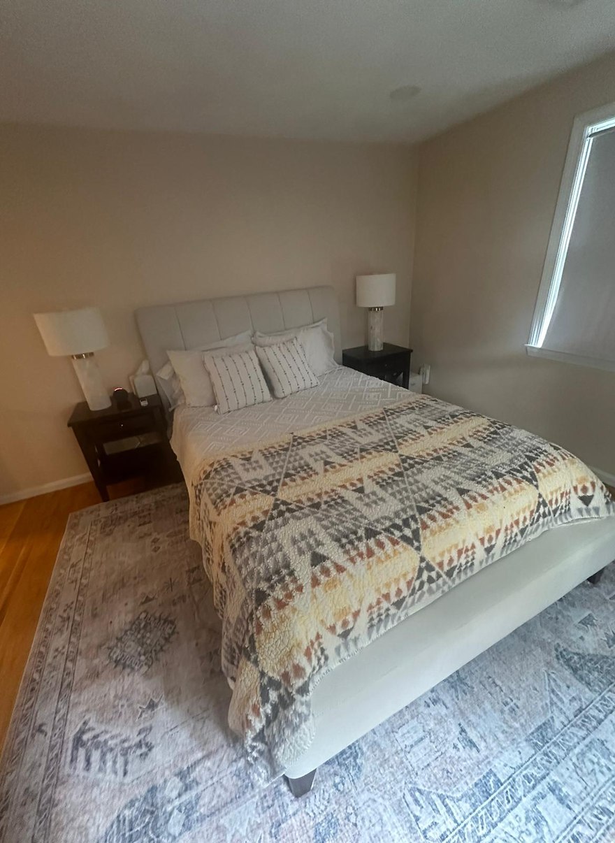 Neatly cleaned and tidy bedroom in a Metro Boston home by Allegry Cleaning Services
