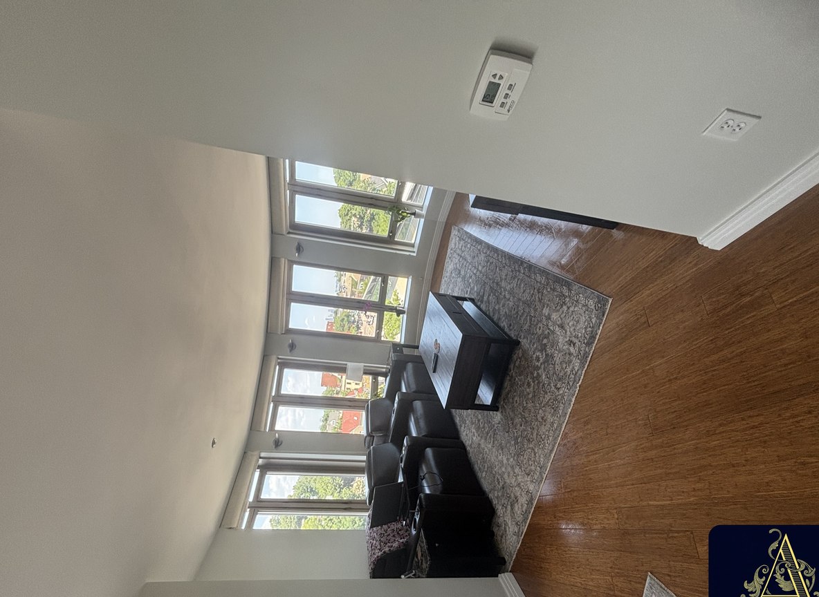 Neatly made king bedroom cleaned by Allegry Cleaning Services