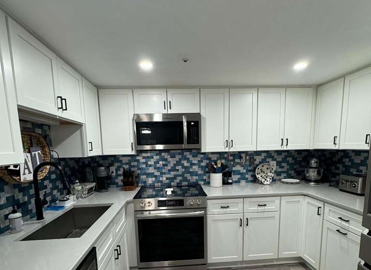 Spotless white kitchen cleaned by Allegry Cleaning Services in Metro Boston